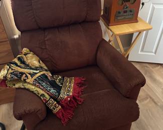 This is a great rocker recliner. It’s very comfy. The old old-fashioned radio to the right is a reproduction it has AM/FM and a CD player. It works perfect we’ve been using it all week.