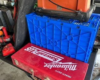 These next few shots are of a banquet table filled with Milwaukee tools and many other brands. This is a Milwaukee SAWZALL plus and its metal box!