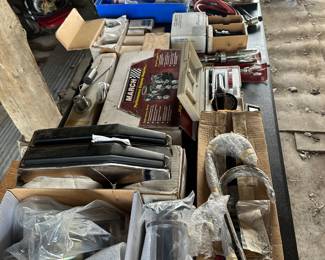 This is an entire 8 foot banquet table filled with vintage car, accessories, and parts