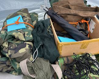 This table has a series of hunting blinds, mesh sacks, and more.