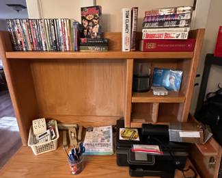 Do you like your computer desk filled with assorted office items, DVDs, and some books!