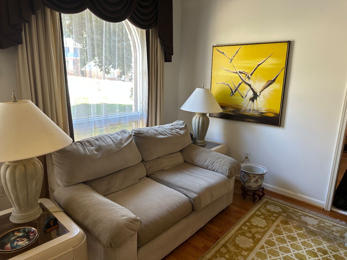 Living Room Sofa (the picture on the wall was kept by family)