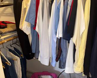 Mens closet with, dress shirts, slacks, jackets, jeans and dress shoes