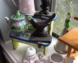 Variety of tea pots, creamer and sugar and cups and mugs
