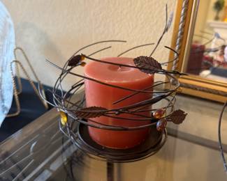 Metal swirling leaf inspired candle holder