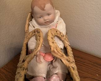 Vintage porcelain baby doll with rattle