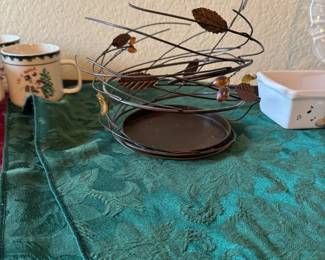 Metal swirling leaf inspired candle holder