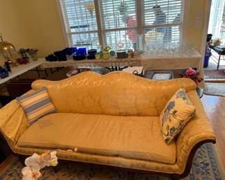 A CHIPPENDALE-STYLE SILK BROCADE-UPHOLSTERED CAMELBACK SOFA WITH COVERS AND EXTRA BROCADE FABRIC,