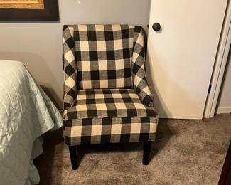 Black & white occasional chair in bedroom