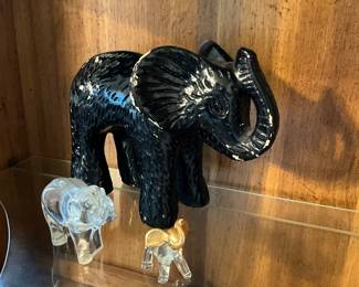 Elephants in display cabinet in office