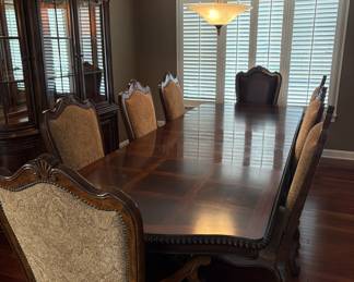 Bernhardt Dining Set plus Hutch featured on the left hand side of the image. The table comes with three extension pieces which is currently shown. The table ranges from 72'-128'. Excellent condition, pickup may be coordinated with Yanni for the week following the sale.