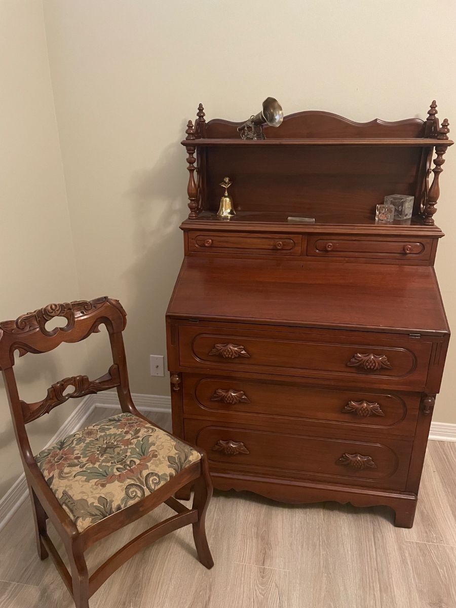 Eastlake-style (ca 1940) solid walnut slant front desk.  56” tall, 34” wide, 20” deep.  $400