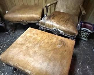 Old Hickory Tannery chair and ottoman made from animal hide.