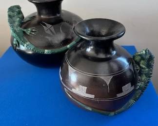 2 handmade black etched potter vase from Mexico, featuring an applied green iquana lizard.