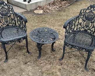 Vintage cast iron side chairs and side table.