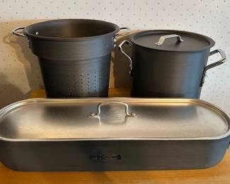 Calphalon Commercial hard-anodized fish poacher with lid, stock pot and strainer.