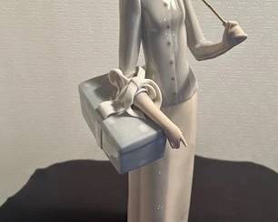 Lladro "Professional Dressmaker" figure.