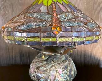 Tiffany-style dragonfly table lamp with stained glass shade and brass base.