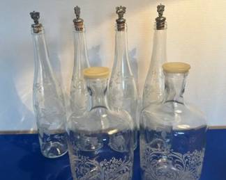 Vintage etched glass bottles and decanters.