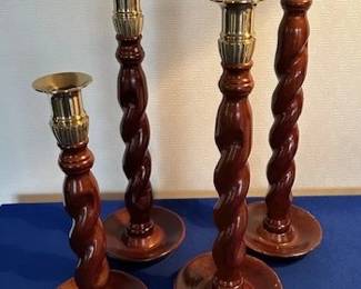 Set of vintage wood and brass twist candlesticks.