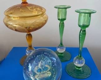 Pair of green Pairpoint glass candlesticks with clear air trap knobs, Pairpoint amber colored engraved air glass covered compote.