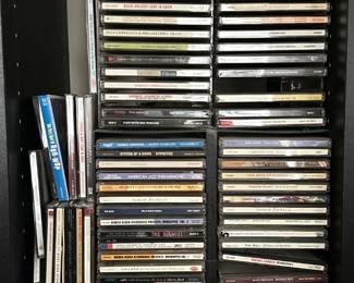 Over 100 CDs With Storage Racks
Lot #: 105