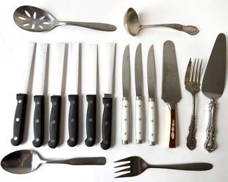 6 New Diamond Cut Steak Knives, Sterling Silver Ladle, 3 French Bakelite Knives, Carved Cake Knife & More
Lot #: 67