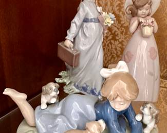 Lladro - the girl with the suitcase and the girl playing with the dogs are sold.