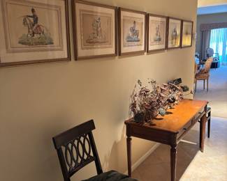 Vintage wall prints , antique fokding chairs , MCM planting hall
Table 