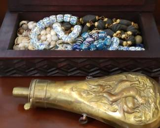 Additional venetian beads, cowrie shells and brass powder flask