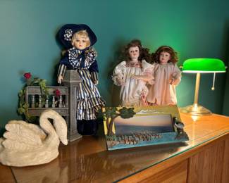 Vintage dolls, picture frame, desk lamp, swan