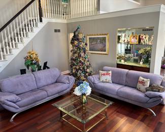 Couches, glass top coffee table, Christmas tree