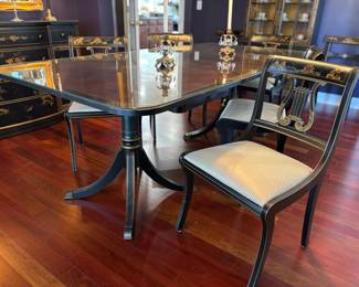 Asian inspired dining table with 8 chairs (table collapses into a very small dining table)