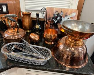 Copperware, colanders, pig, pitchers, copper tea pot