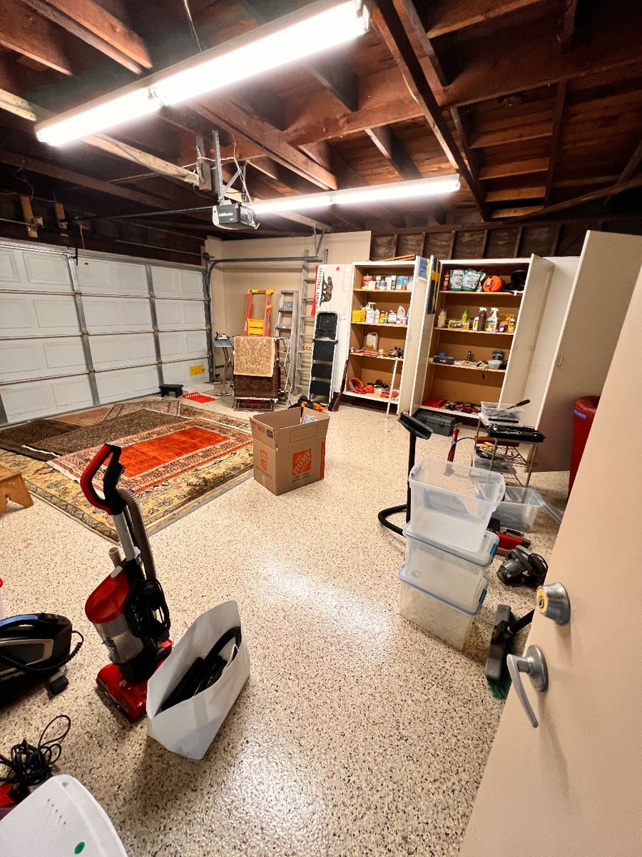 Several hand woven, vintage oriented rugs.