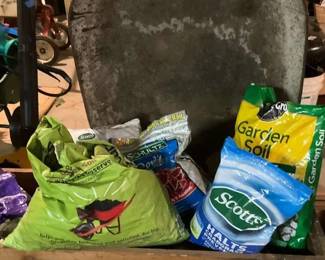 Wheelbarrow and Gardening Supplies Soil, Fertilizer, and More