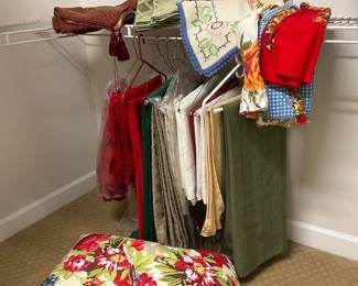 A miscellaneous lot of formal tablecloth, runners, placemats, aprons, pillows, outdoor umbrella
