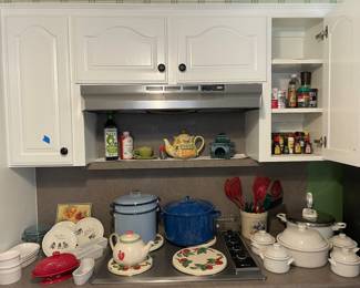 Packed kitchen with household items including Enamel ware