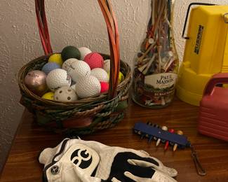 Golf balls, tees, gloves and clubs