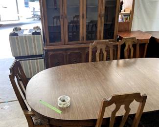 Table with six chairs and hutch
