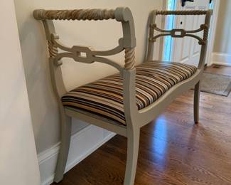 Gray upholstered striped bench