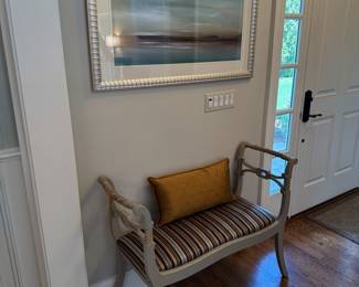 Gray upholstered striped bench