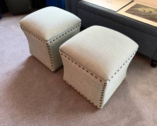 Beige upholstered studded square storage ottomans
