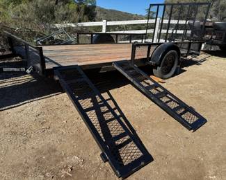 Trailers have vehicle ramps for loading on the side of the trailer.