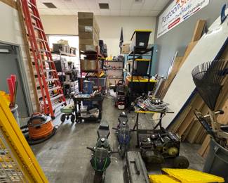 Wide shot of warehouse, everything must go.