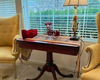 Antique mahogany flip top game/console table with metal claw feet
