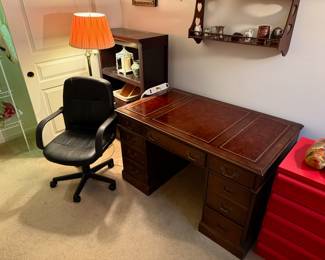 Early American Chippendale style 9-drawer desk; office chair 