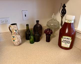 Assorted glass bottles and vessels