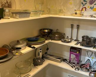 Assortment of pots, including pressure cooker, electric counter Bowls, bowls, baking, ware, and more