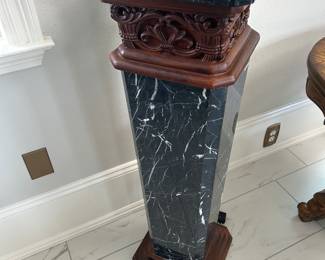  unique, mahogany carved and black marble pedestal